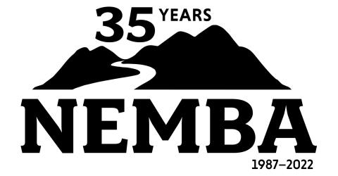 Graphic of NEMBA organization logo celebrating 35 years. Logo is a silhouette of a mountain with a trail path going up the mountain.